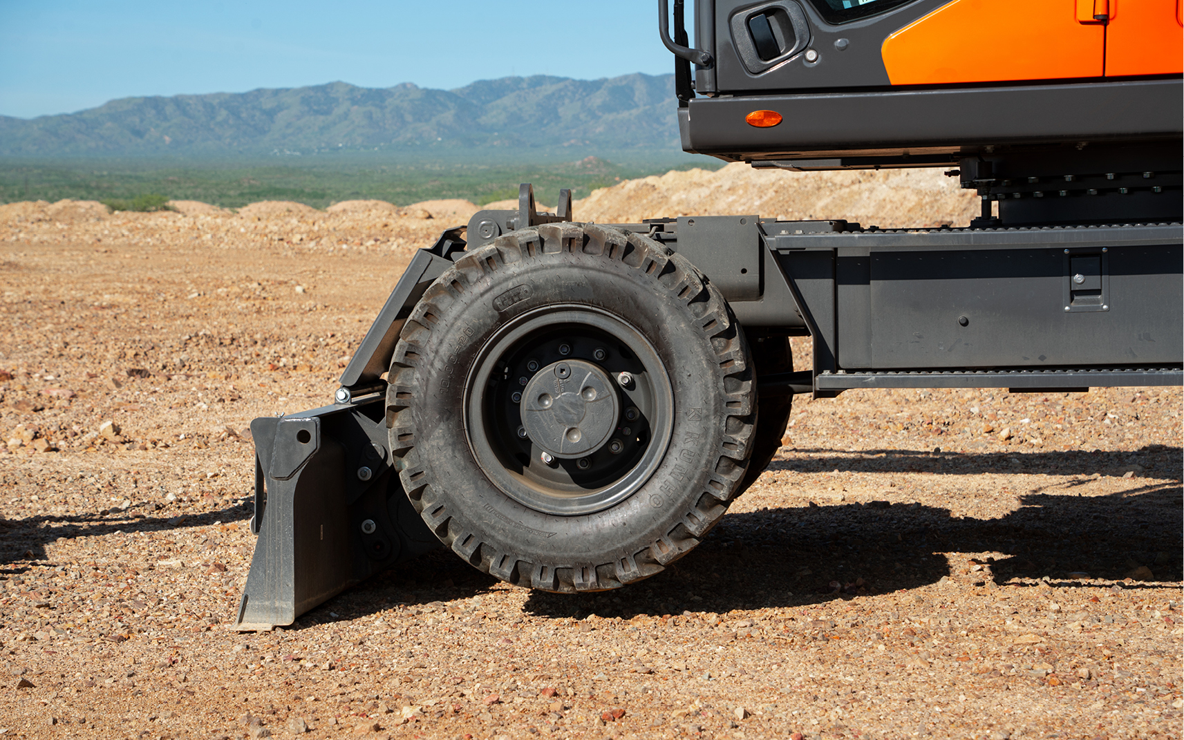 A dozer blade configuration is popular for a wheel excavator.