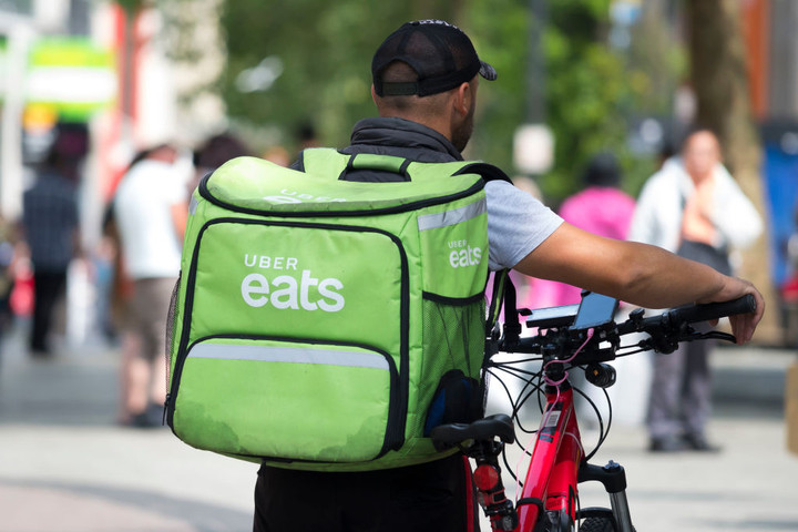 Uber Buys Postmates in Food Delivery Bet
