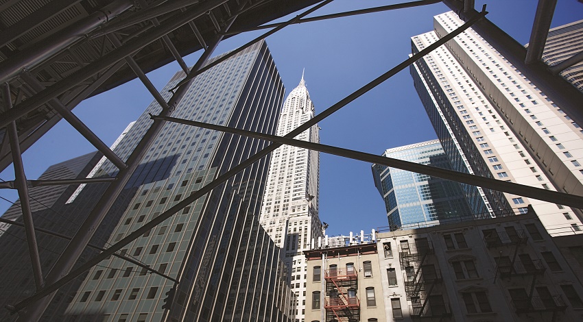 The New York City skyline as viewed from the street, looking up at the Empire State Building