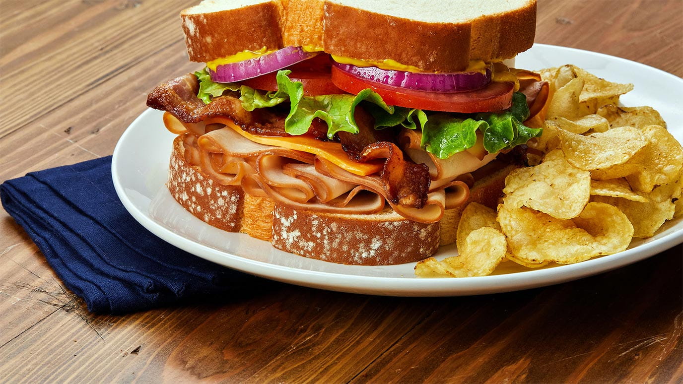smoked_turkey_sandwich_with_cheddar_cheese_and_bacon_1376x774.jpg
