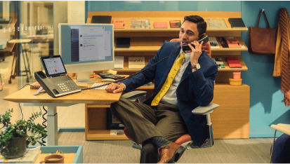 man using deskphone