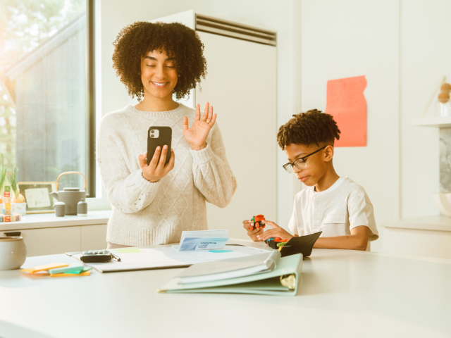 Women helping son with homework