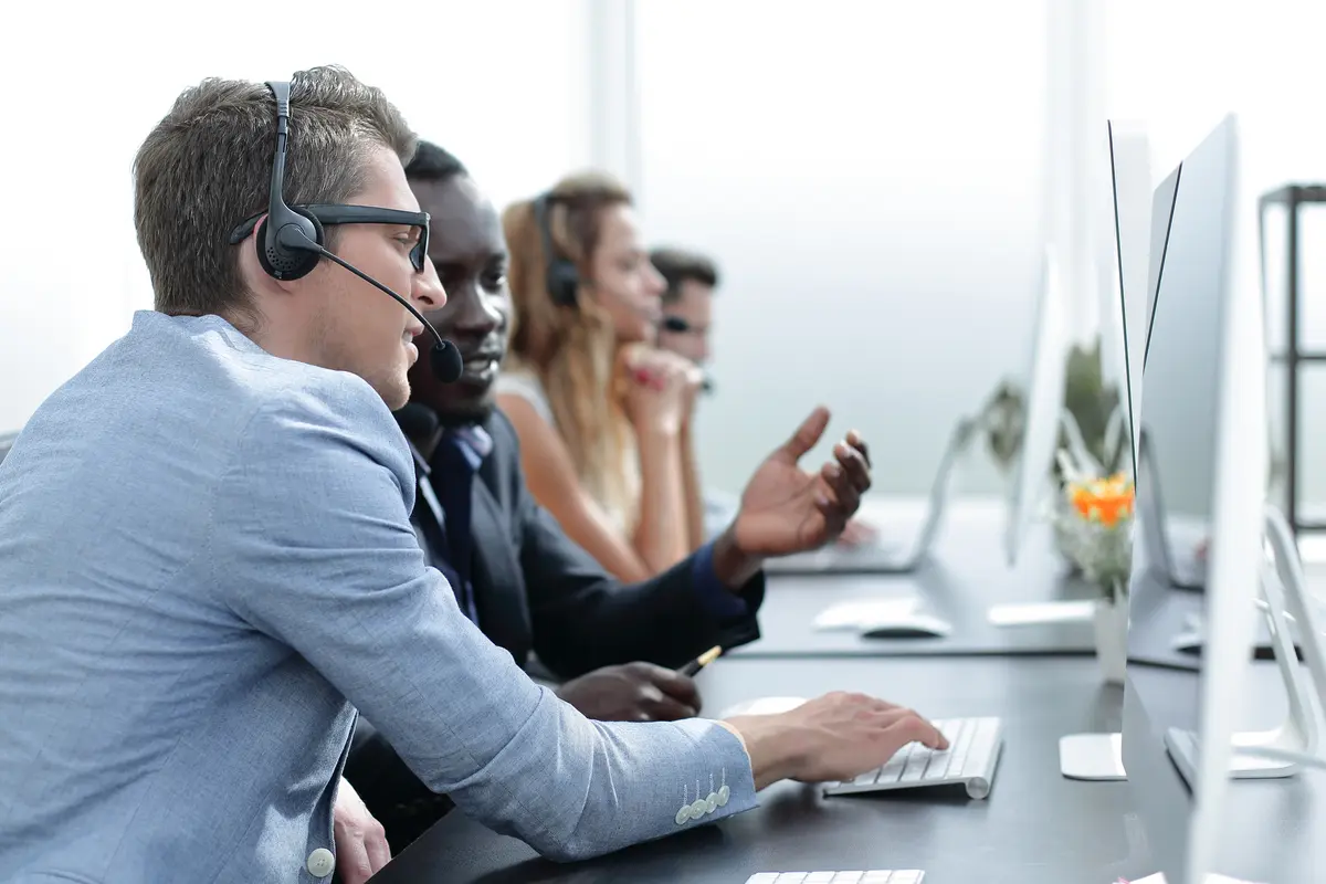 Agents in a call center talking on headsets
