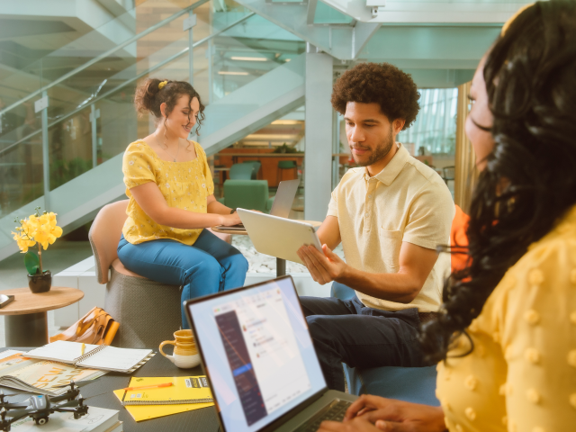 Cc Chat Hybrid People working in an open office