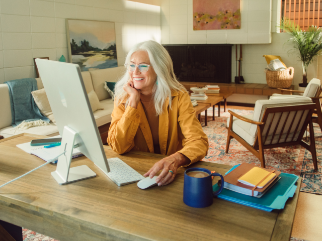 Woman in office at computer desk Woman in office at computer desk