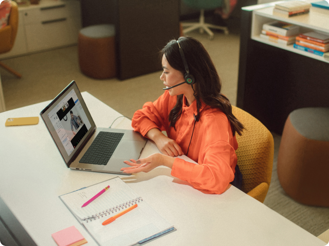 Woman at desk on zoom meetings Woman at desk on zoom meetings