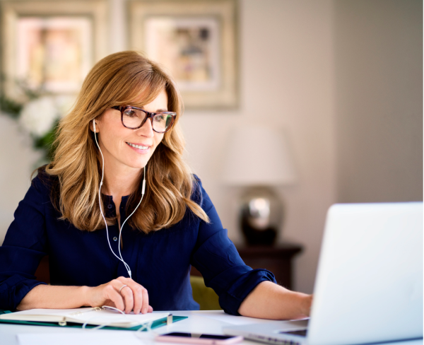 Woman smiling at laptop