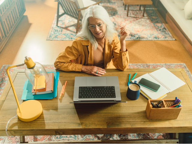 Help Desk Overhead Woman working at desk