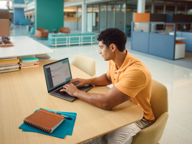 man typing with zoom chat